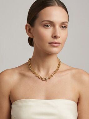 80. Brass horseshoe necklace